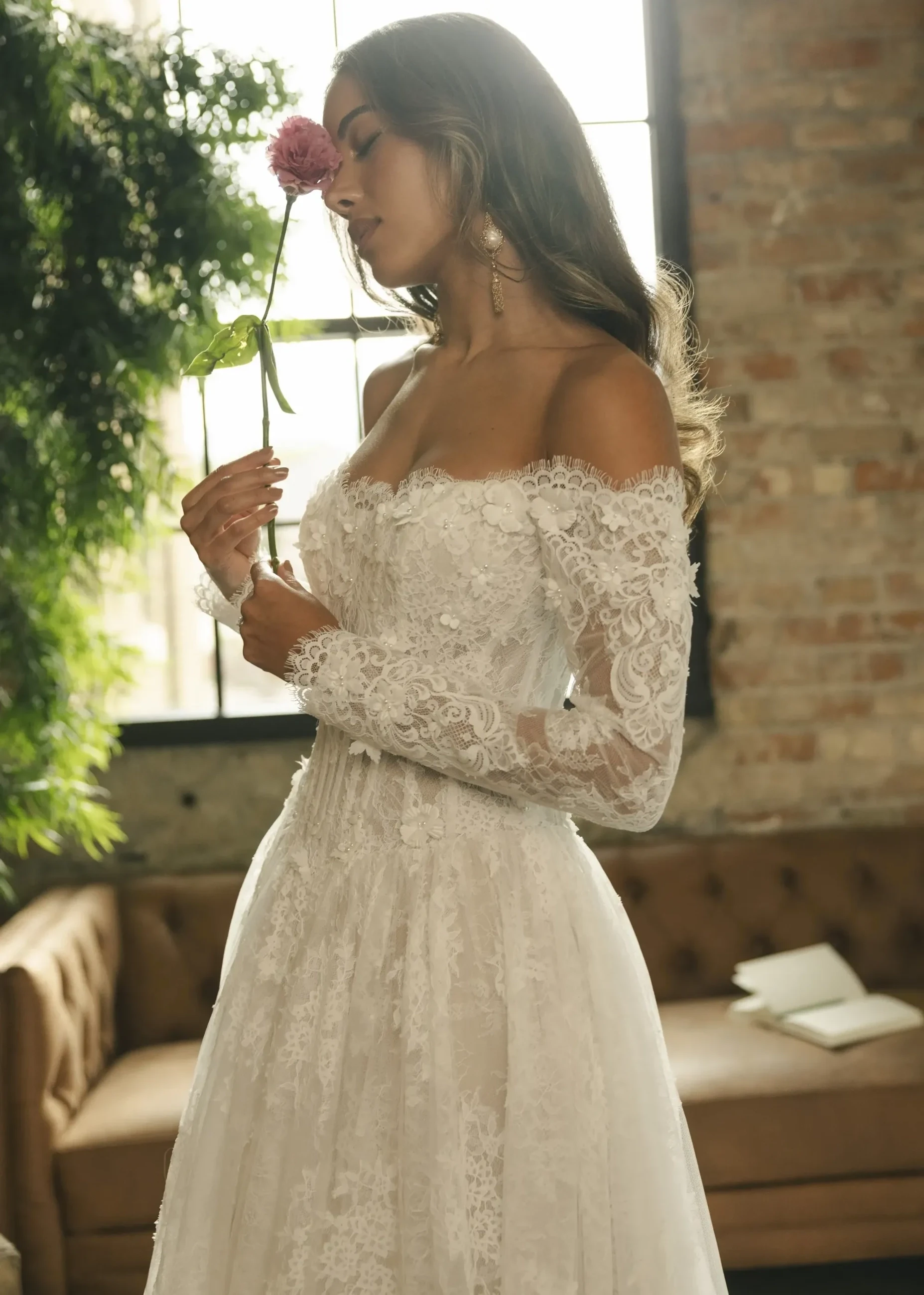 Photo of the model wearing a white bridal gown