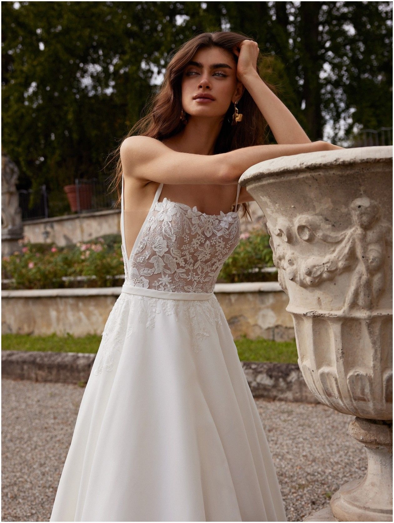 Photo of the model wearing a white bridal gown