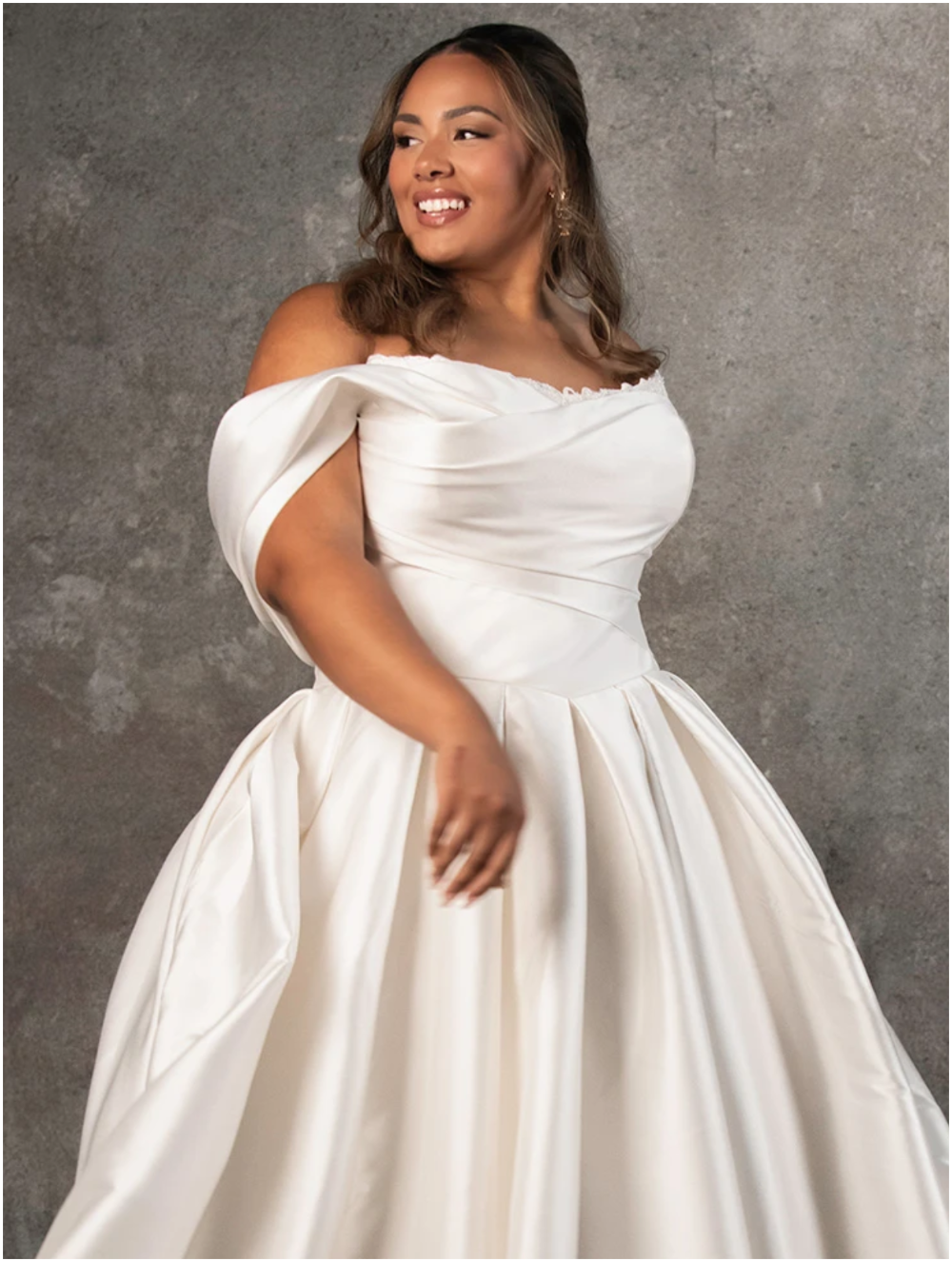Photo of the model wearing a Plus size gown