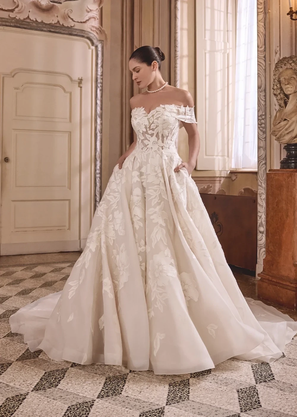 Photo of a bride wearing a Bold and Dramatic bridal gown.